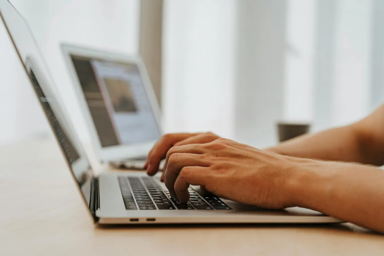 Person typing on a laptop