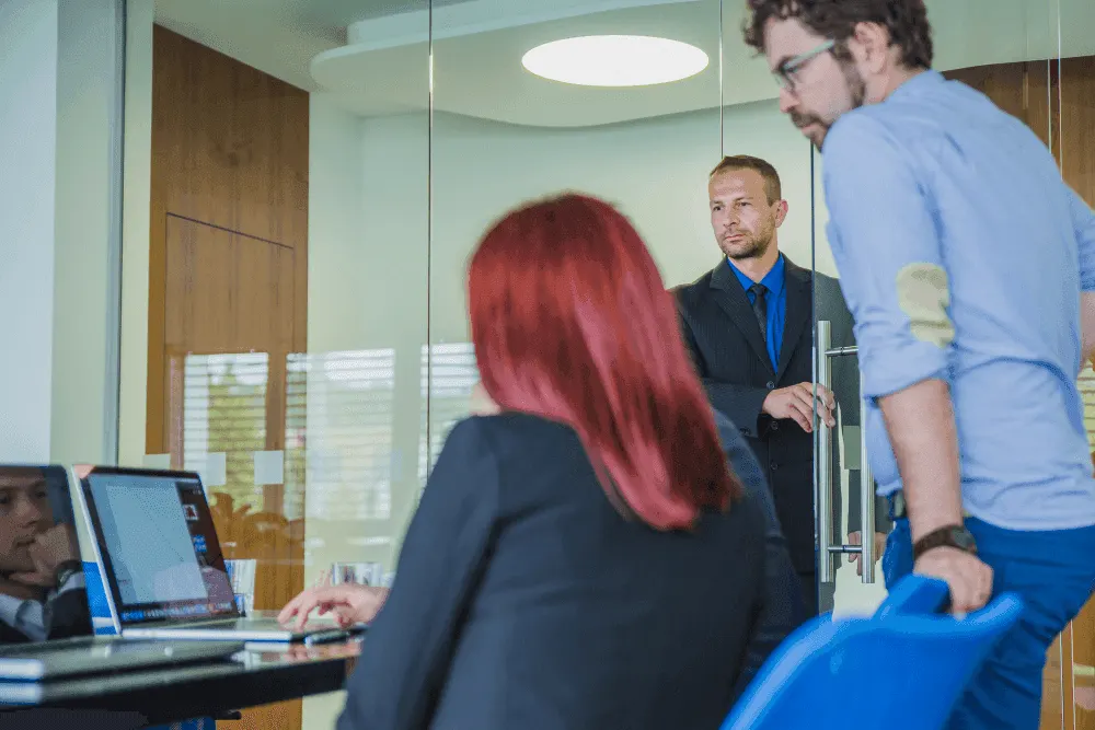 three people working in an office