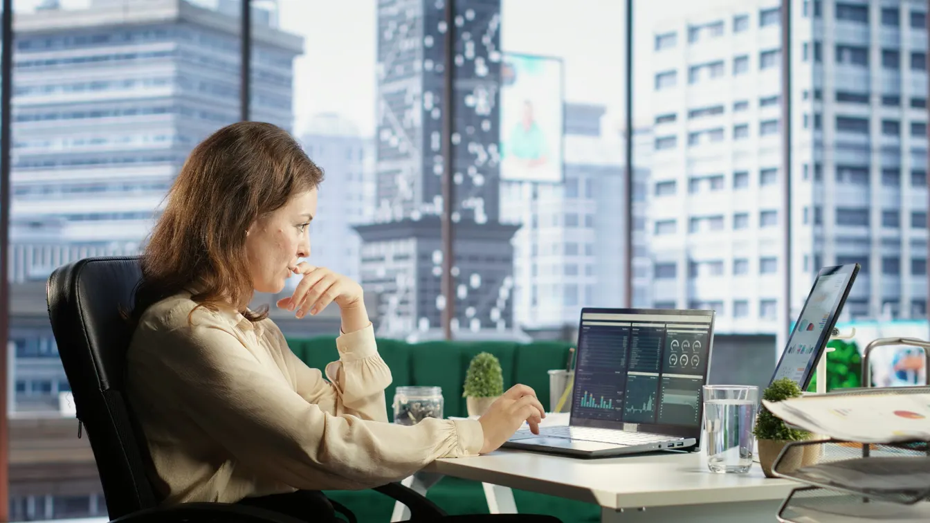 female office worker using a laptop