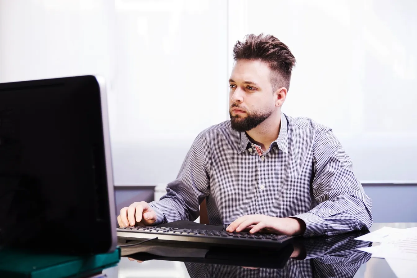 Busy man using a computer