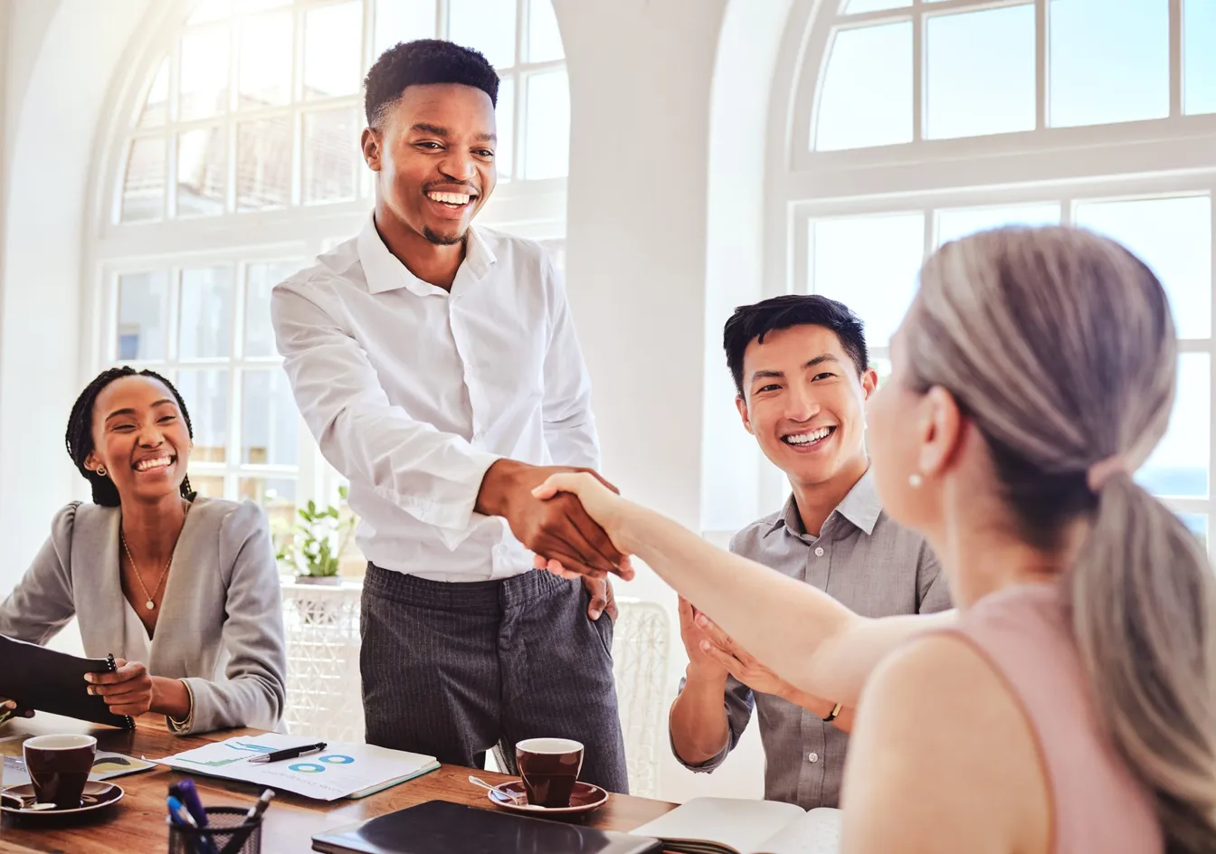 Team members welcoming a new employee